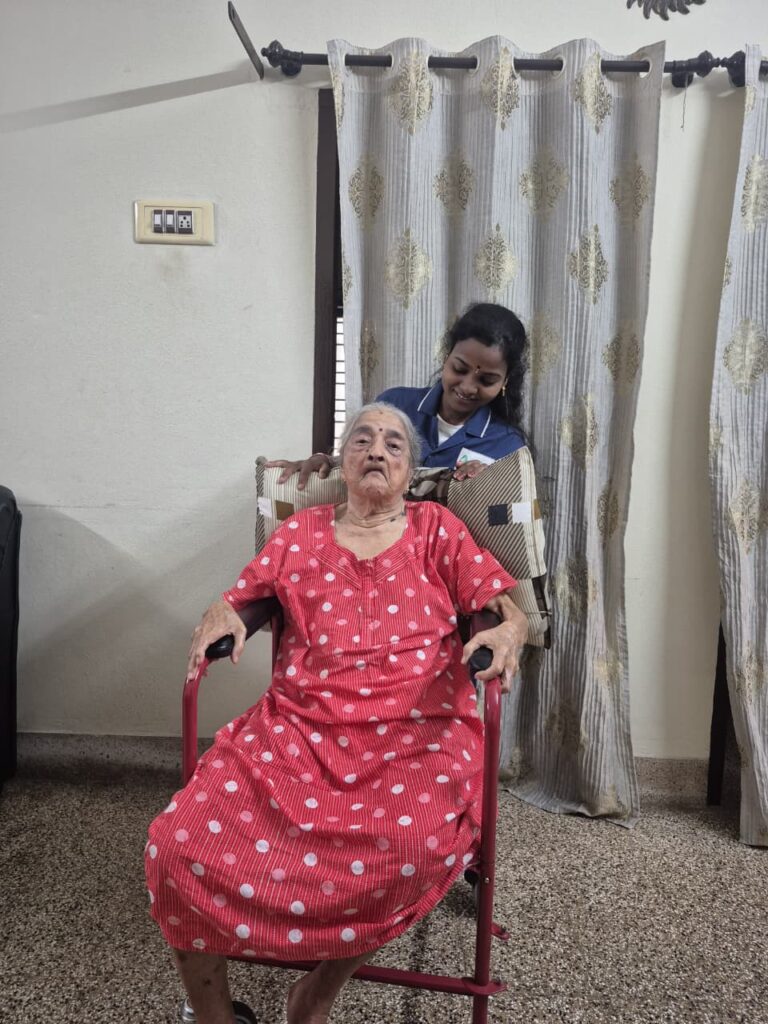 WeCare caregiver reading with an elderly resident at home in Bengaluru (Nursing Gallery)