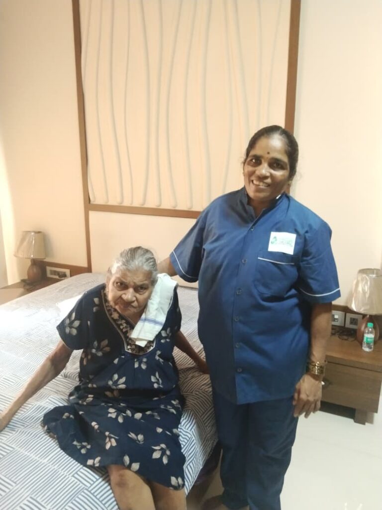 WeCare caregiver assisting a bedridden patient with feeding at home in Bengaluru (Nursing Gallery)