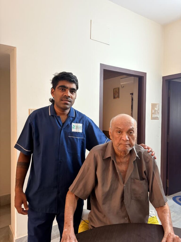 WeCare physiotherapist guiding a mobility exercise at a patient home in Mangaluru (Nursing Gallery)