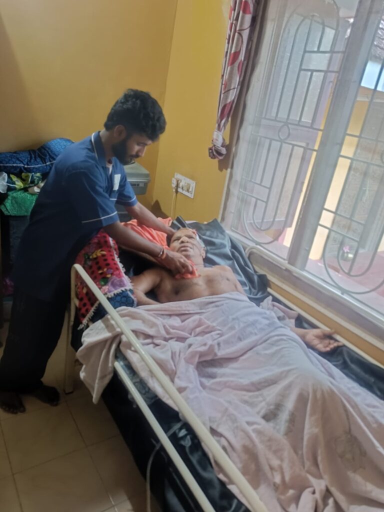WeCare caregiver reading with an elderly resident at home in Bengaluru (Nursing Gallery)