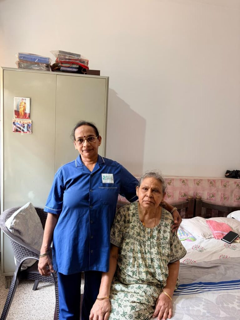 WeCare registered nurse checking the blood pressure of an elderly patient at home in Mangaluru (Nursing Gallery)