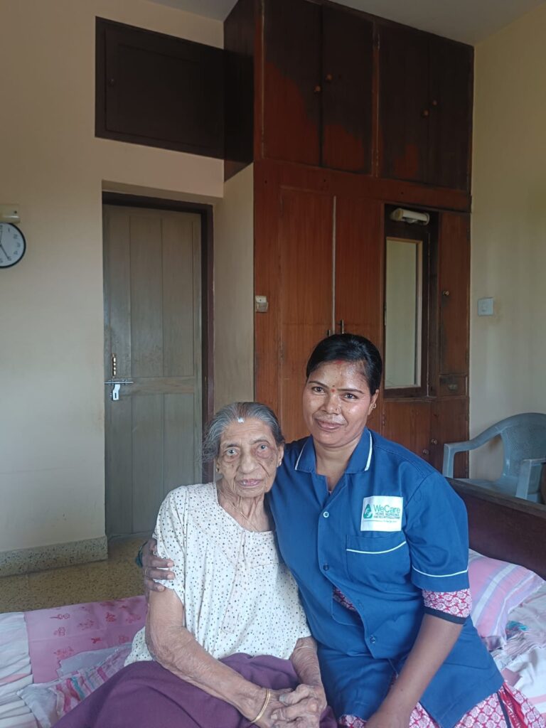 WeCare caregiver assisting a bedridden patient with feeding at home in Bengaluru (Nursing Gallery)